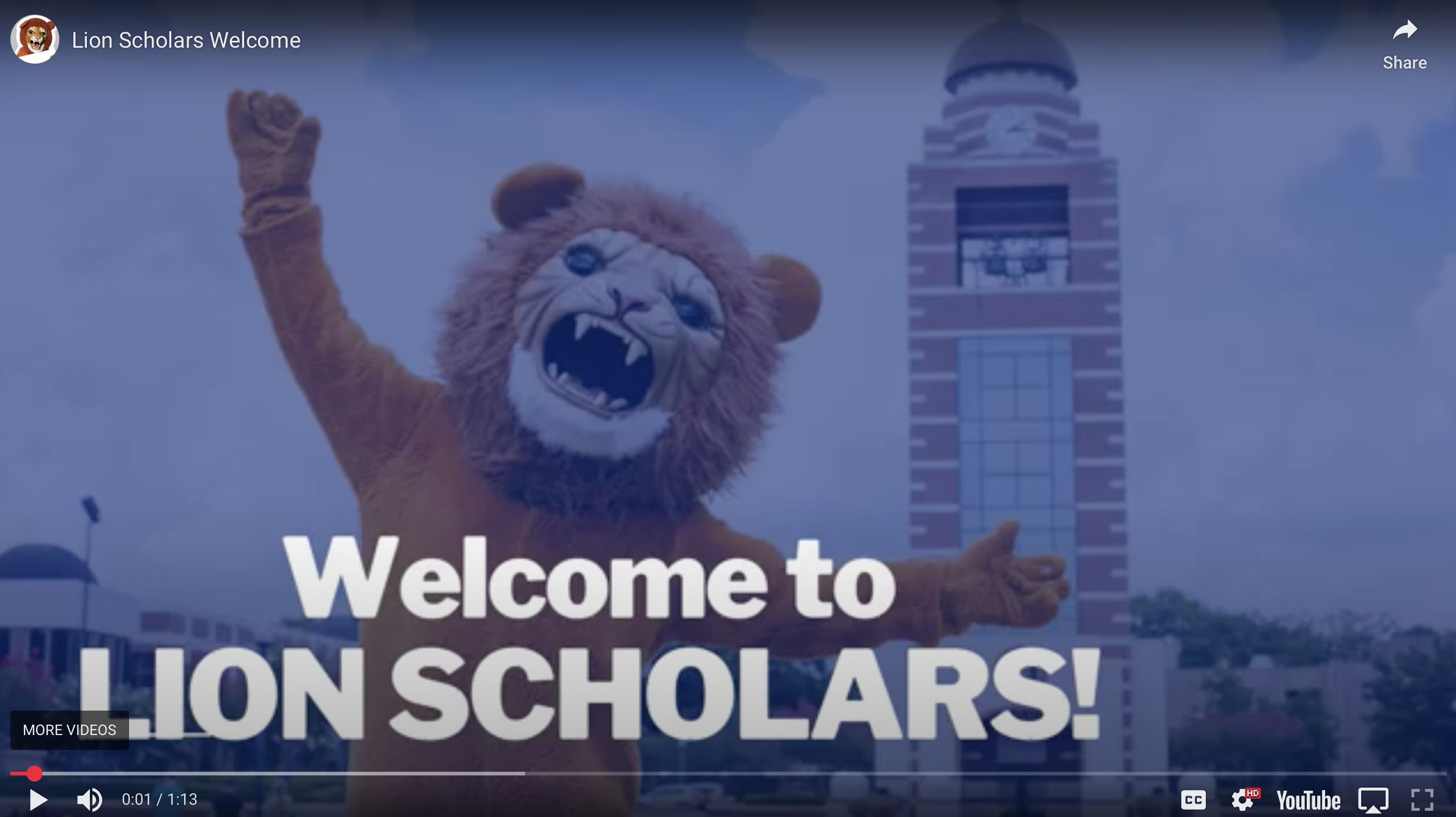 Thumbnail for 'Lion Scholars Welcome' video featuring a lion mascot and campus clock tower in the background.