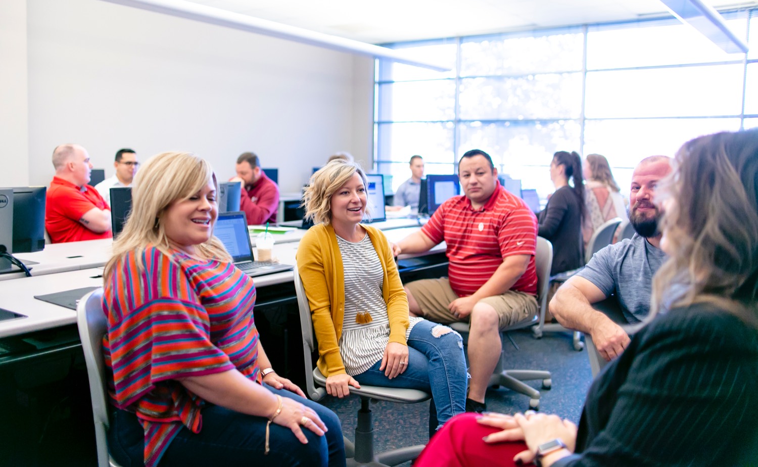 adult students work in a classroom