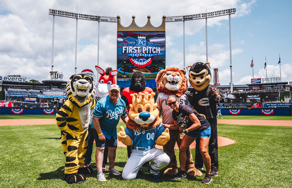 MIAA mascots stand at the mound with the Kansas City Royals mascot