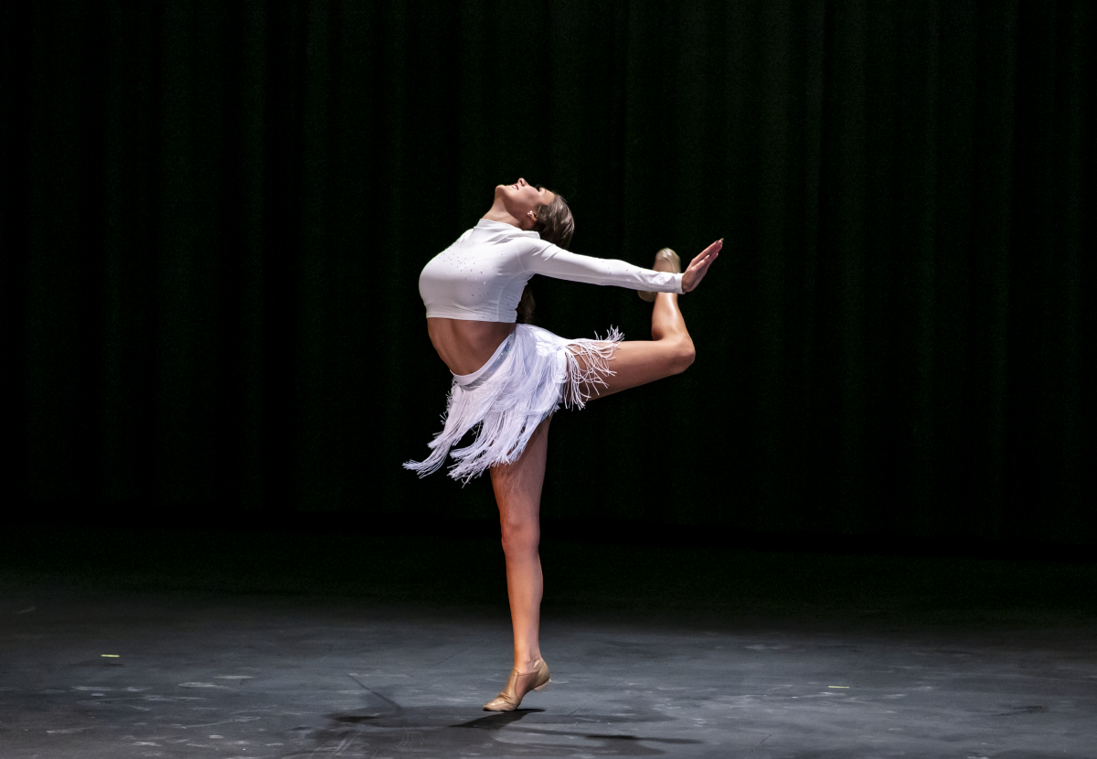 2021MissUAFS Jayson Toney dances in a white dance costume