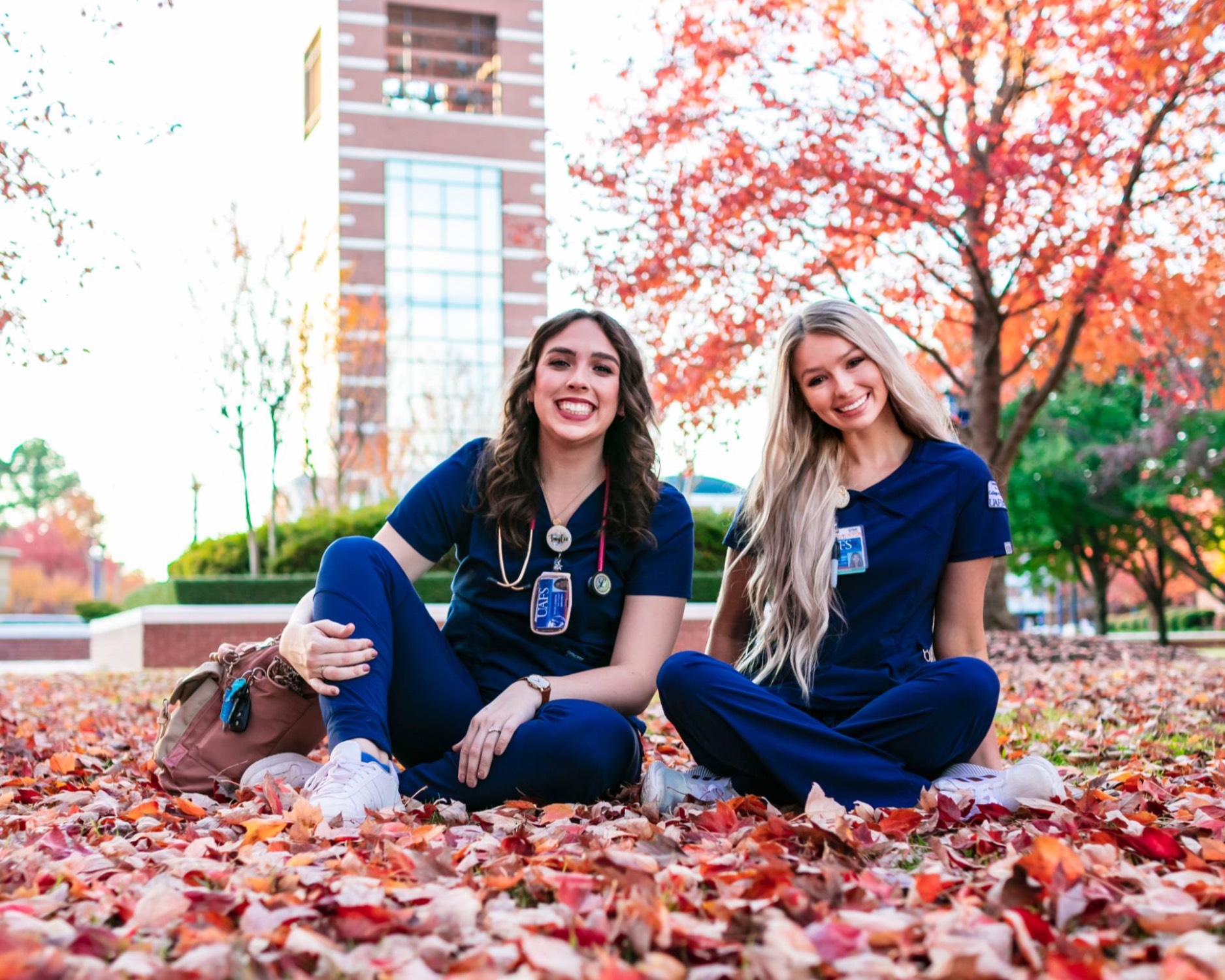 UAFS nursing students pose in fall leaves