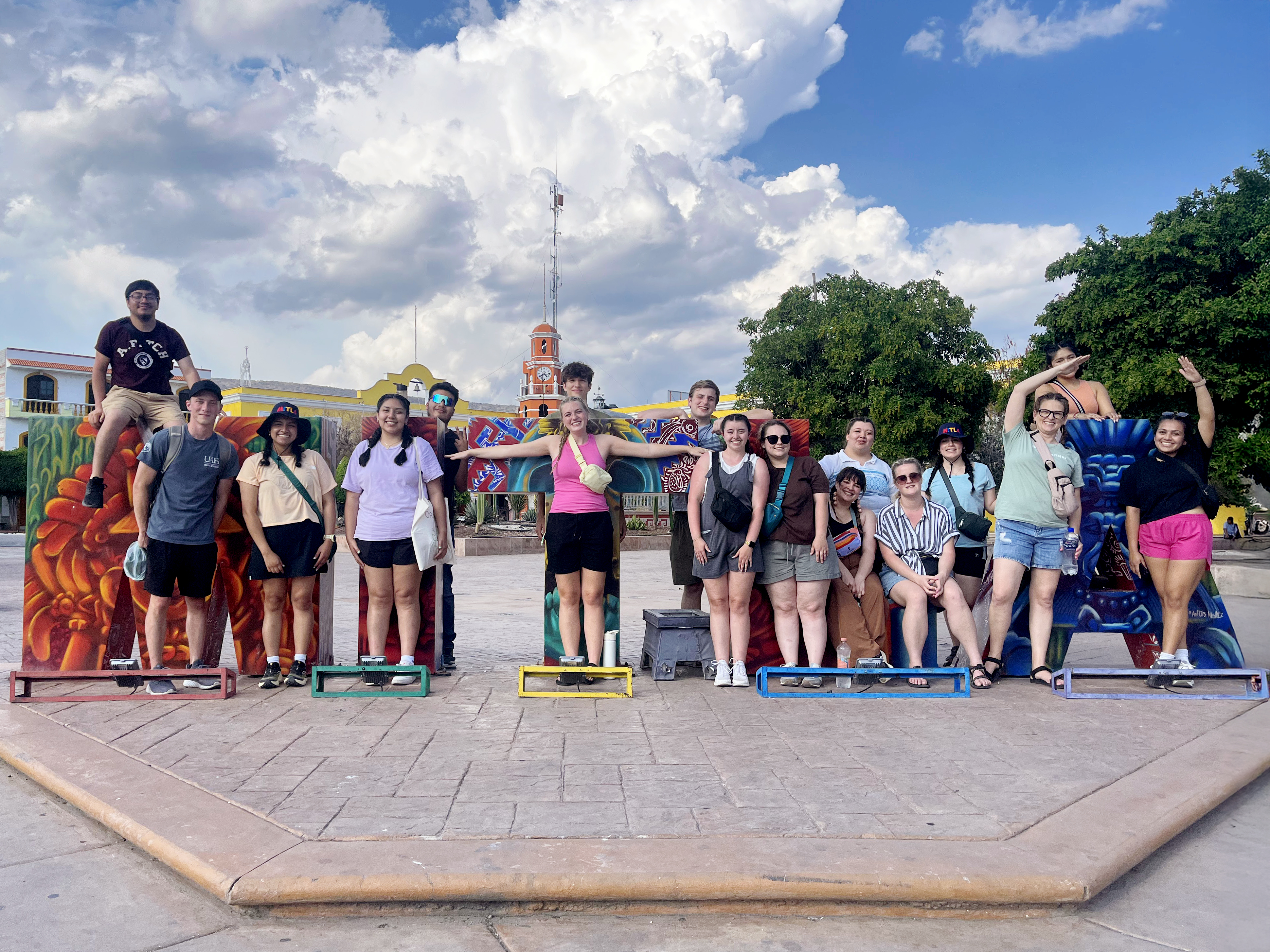 group of students standing in courtyard 