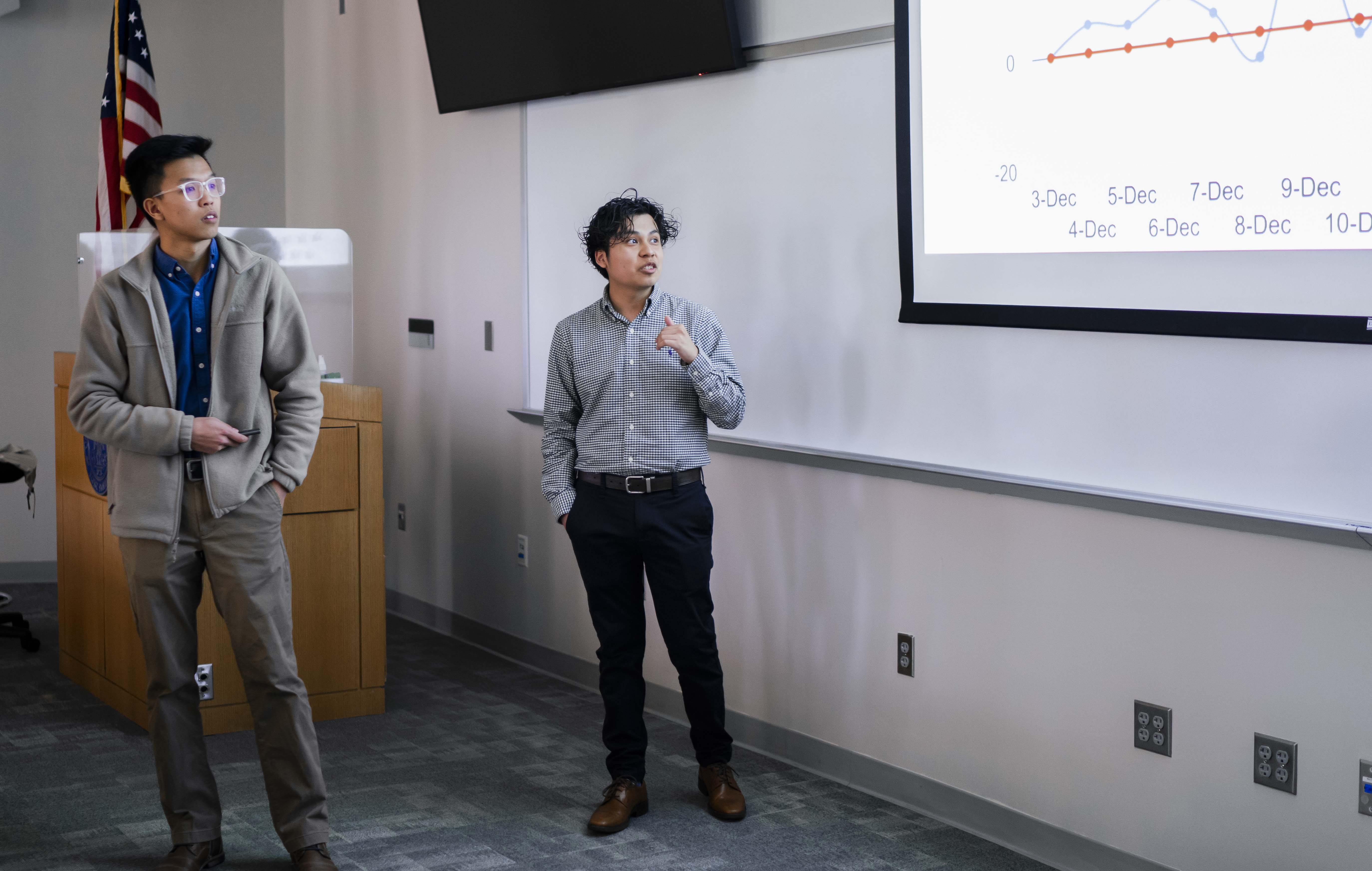 two men read a powerpoint