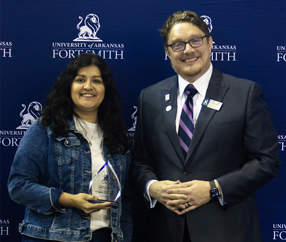 Cristina Castorena, left, accepts her award with UAFS Provost, Dr. Shadow Robinson