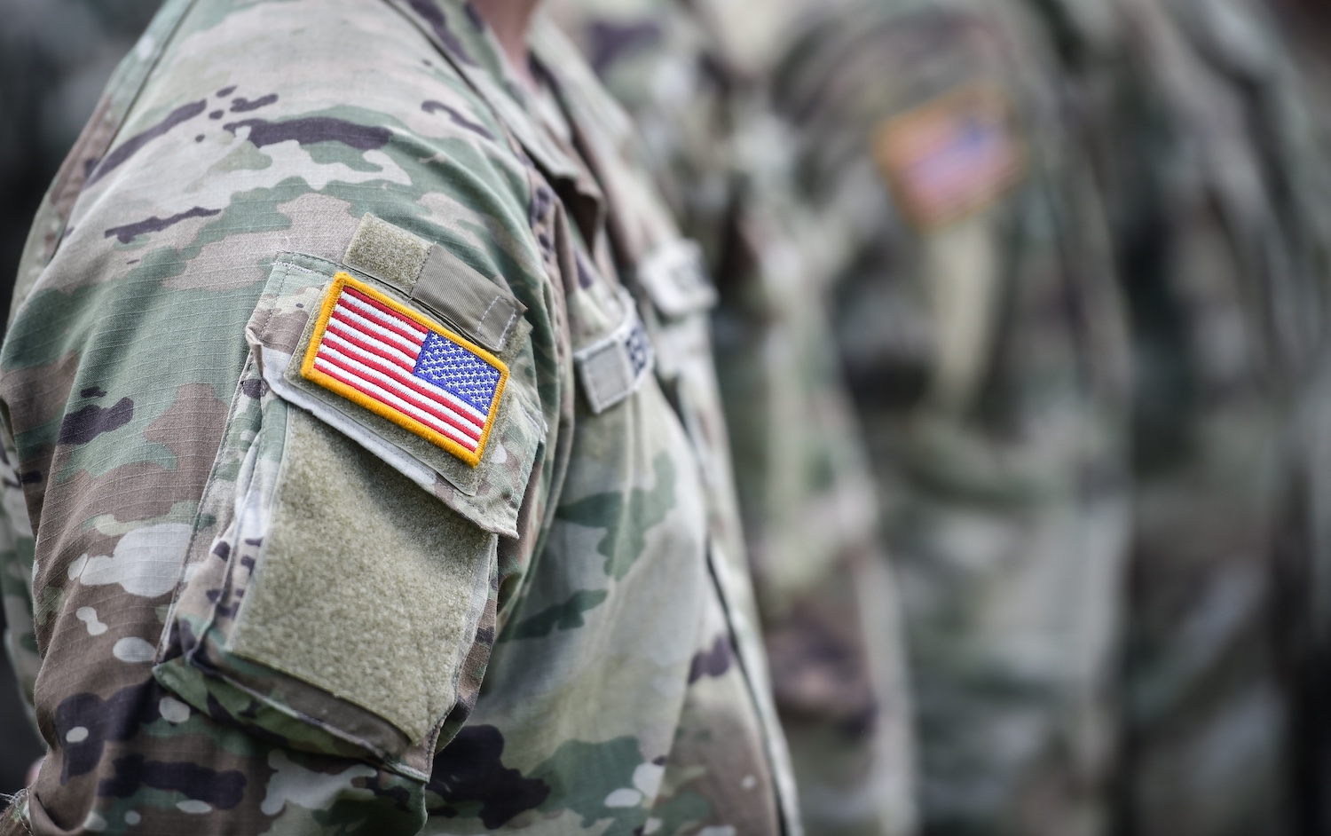 military personnel stand at attention